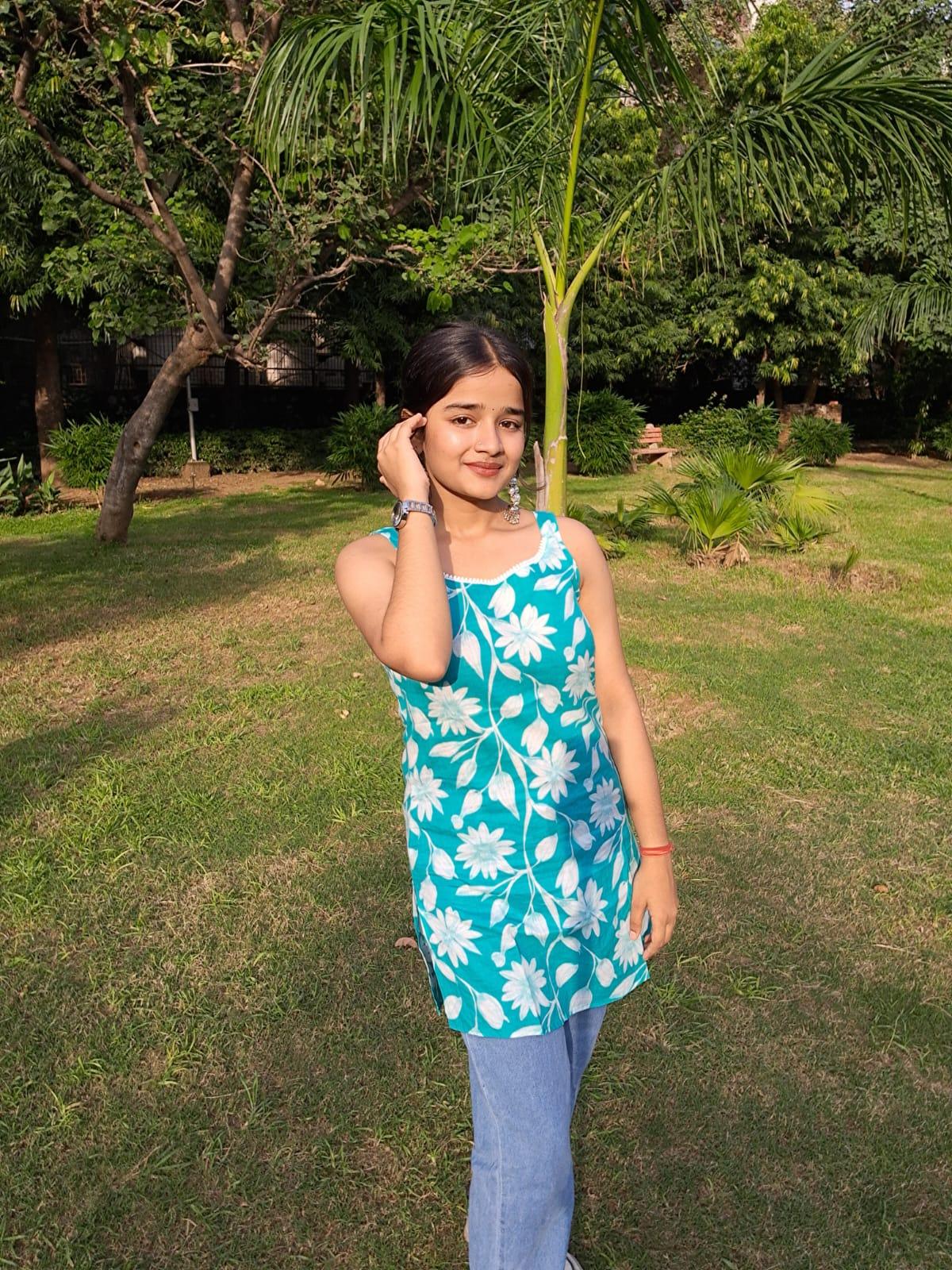 Barnora Tina – Sky Blue Sleeveless Floral Printed Cotton Short Kurta | Summer Casual Kurti for Women